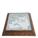 Antique musical trivet made of carved wood and Belle Époque earthenware.