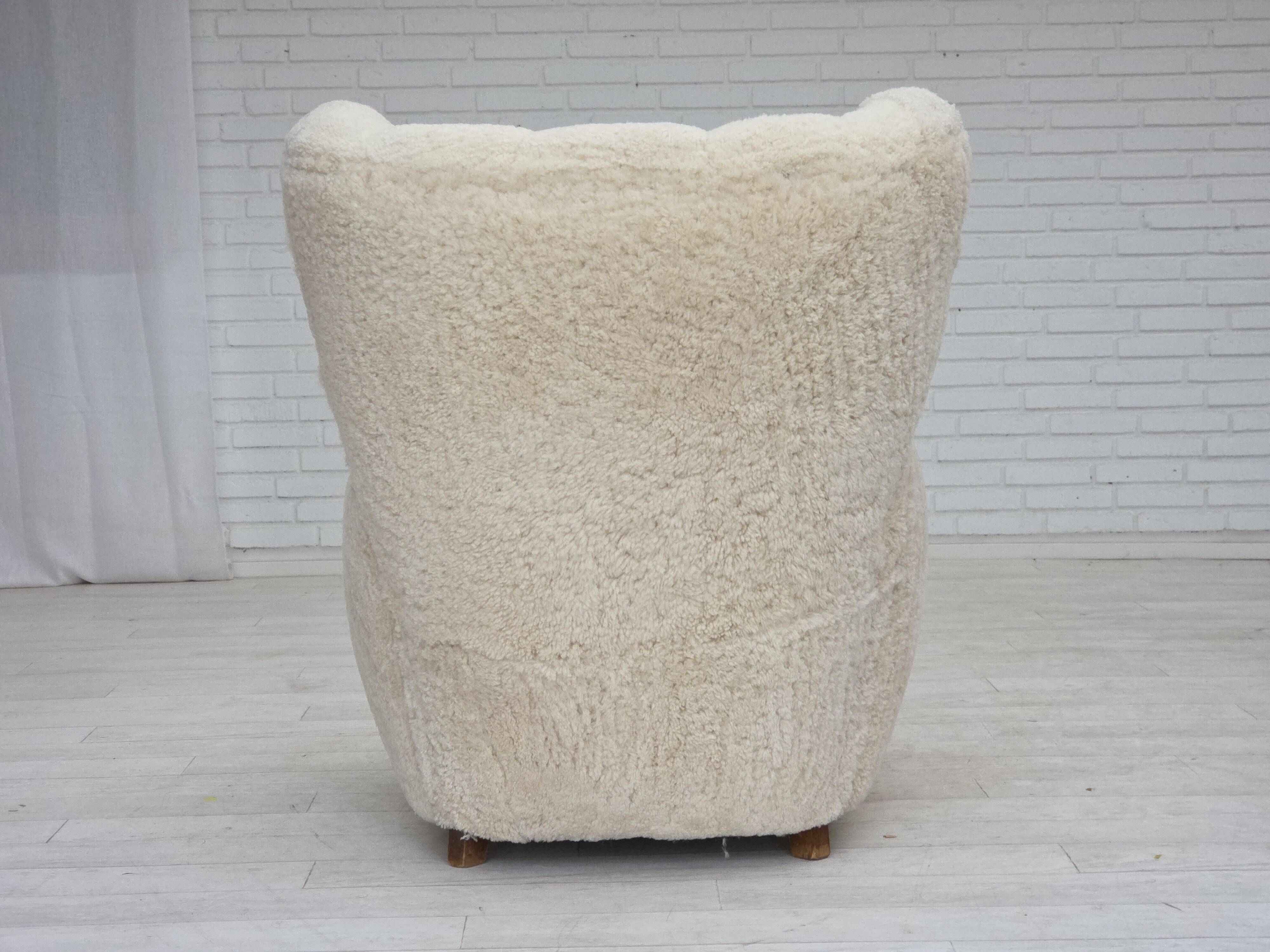 1960s, Danish design, reupholstered highback armchair, genuine sheepskin.