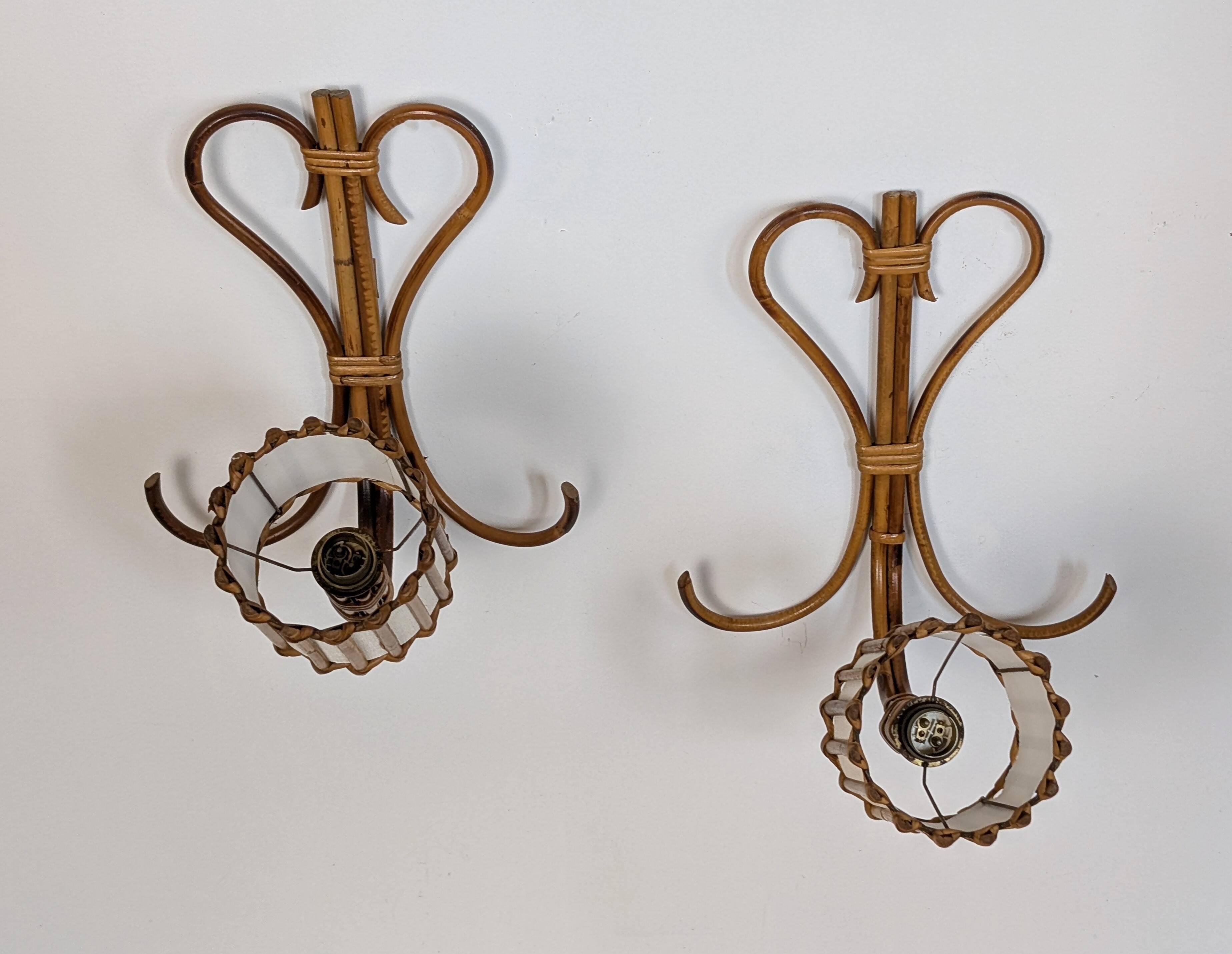 Rattan wall lights by Louis Sognot