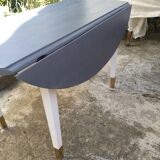 Table with extension cord that folds over the sides