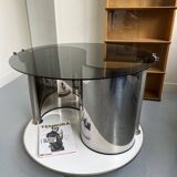 Vintage metal and smoked glass coffee table on casters bar