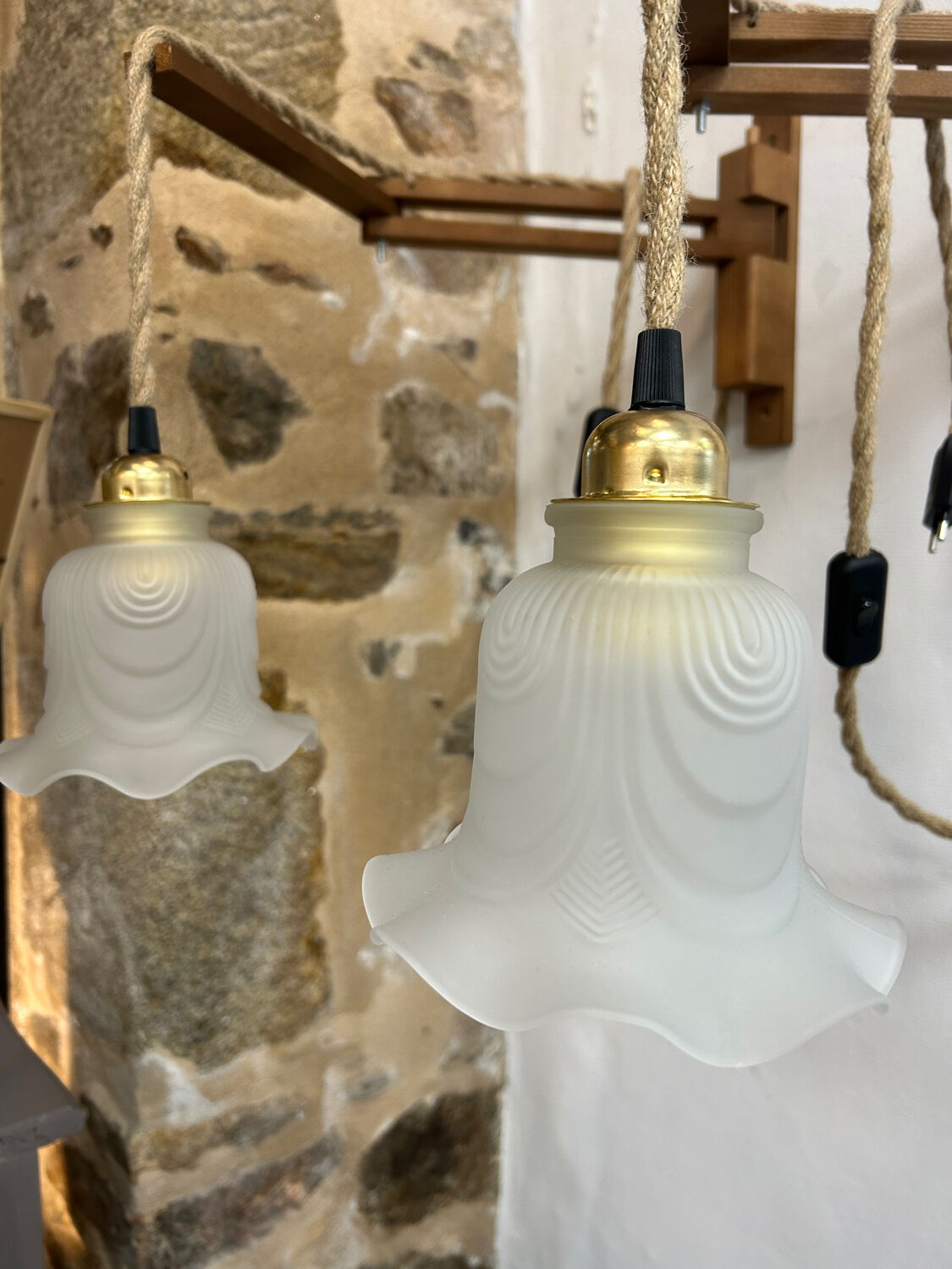 Two portable lamps with wall mount.