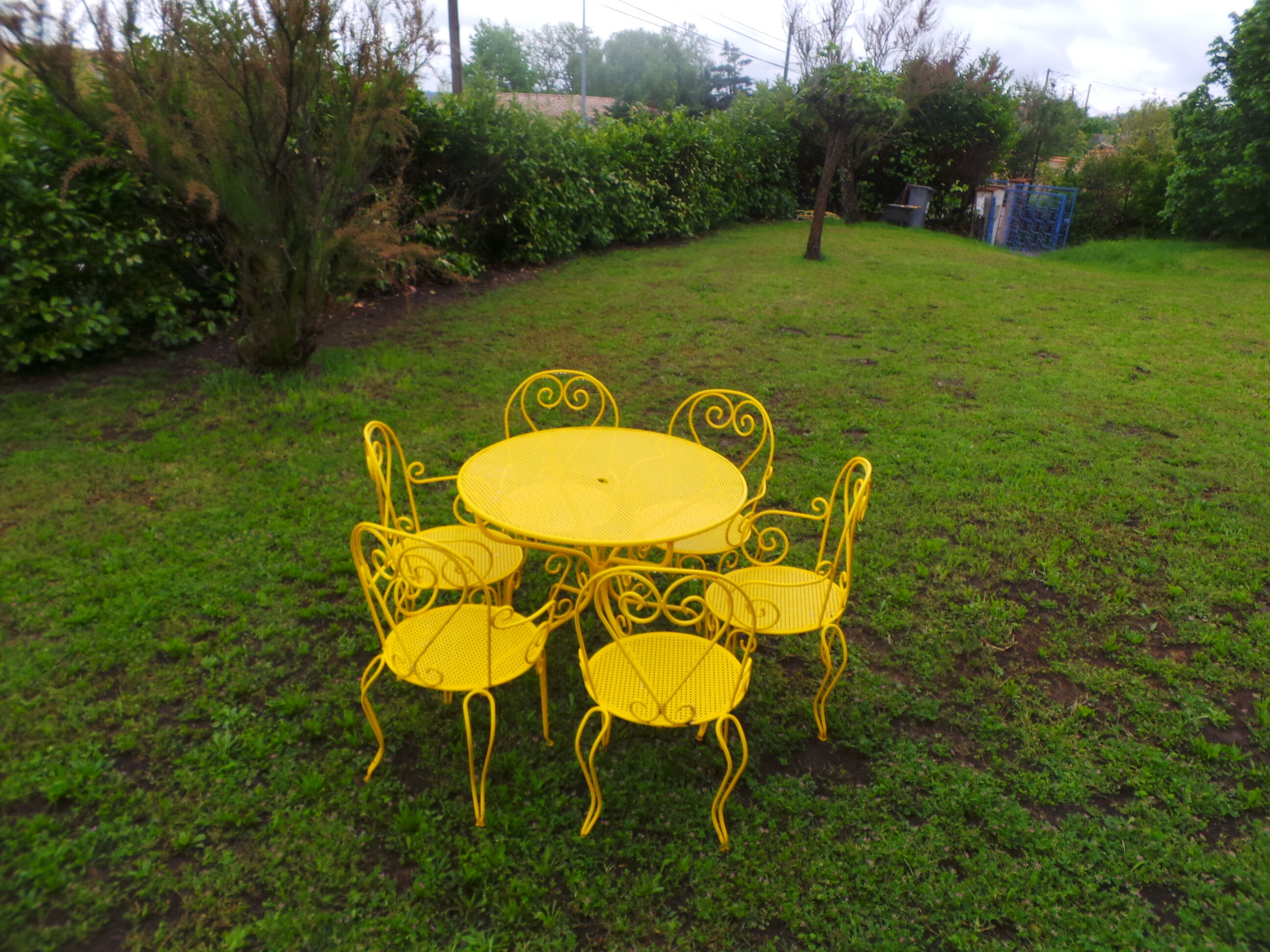 Yellow wrought iron garden room