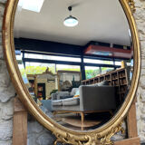 Oval mirror with pediment, beaded gilded with gold leaf