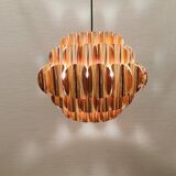 Copper colored hanging lamp. designed by thorsten orrling sweden