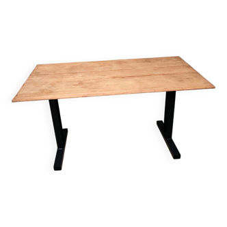 Unique wooden table with industrial metal base