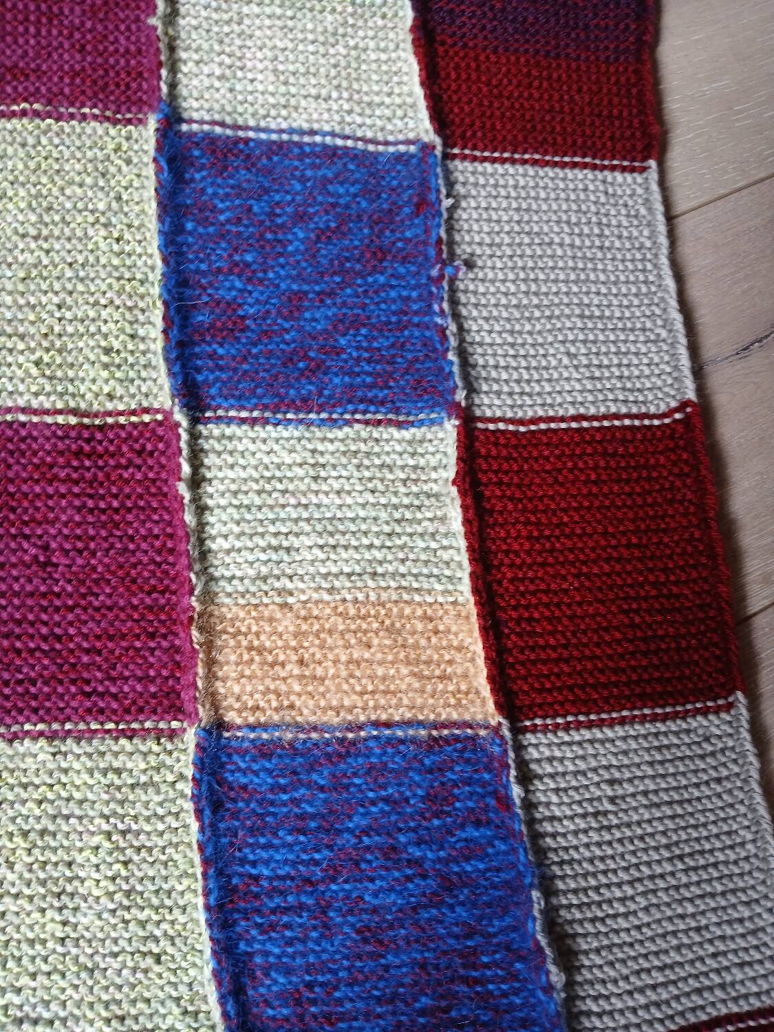Hand knitted patchwork plaid