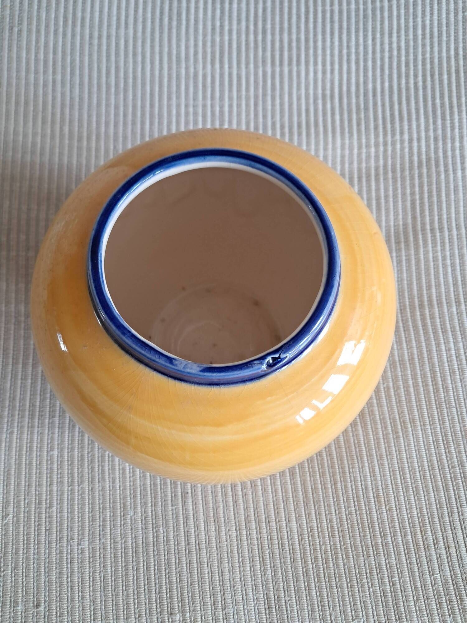 Vintage ceramic vase in a round shape.