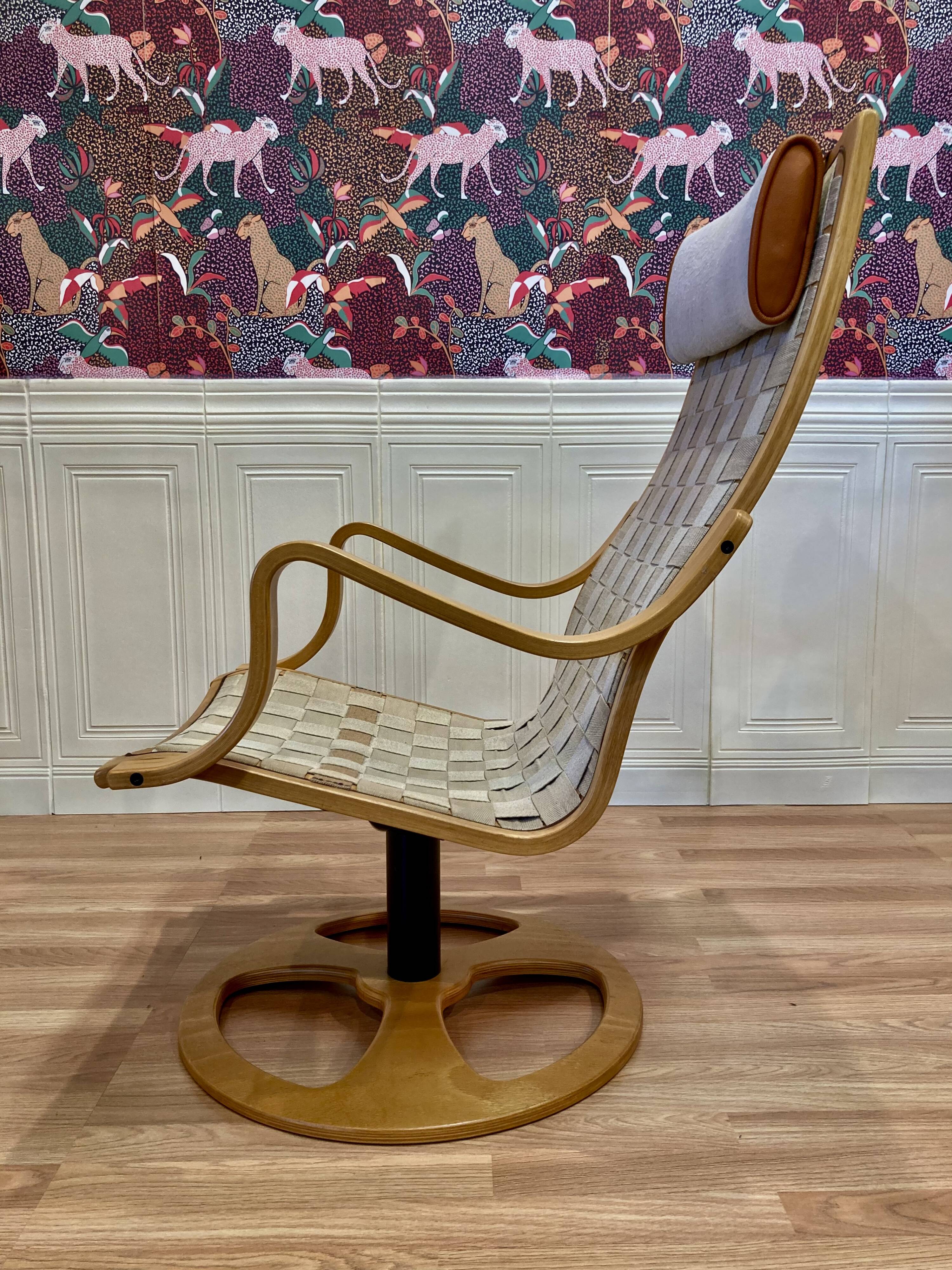 Swivel armchair and its ottoman in 1960s Scandinavian design.