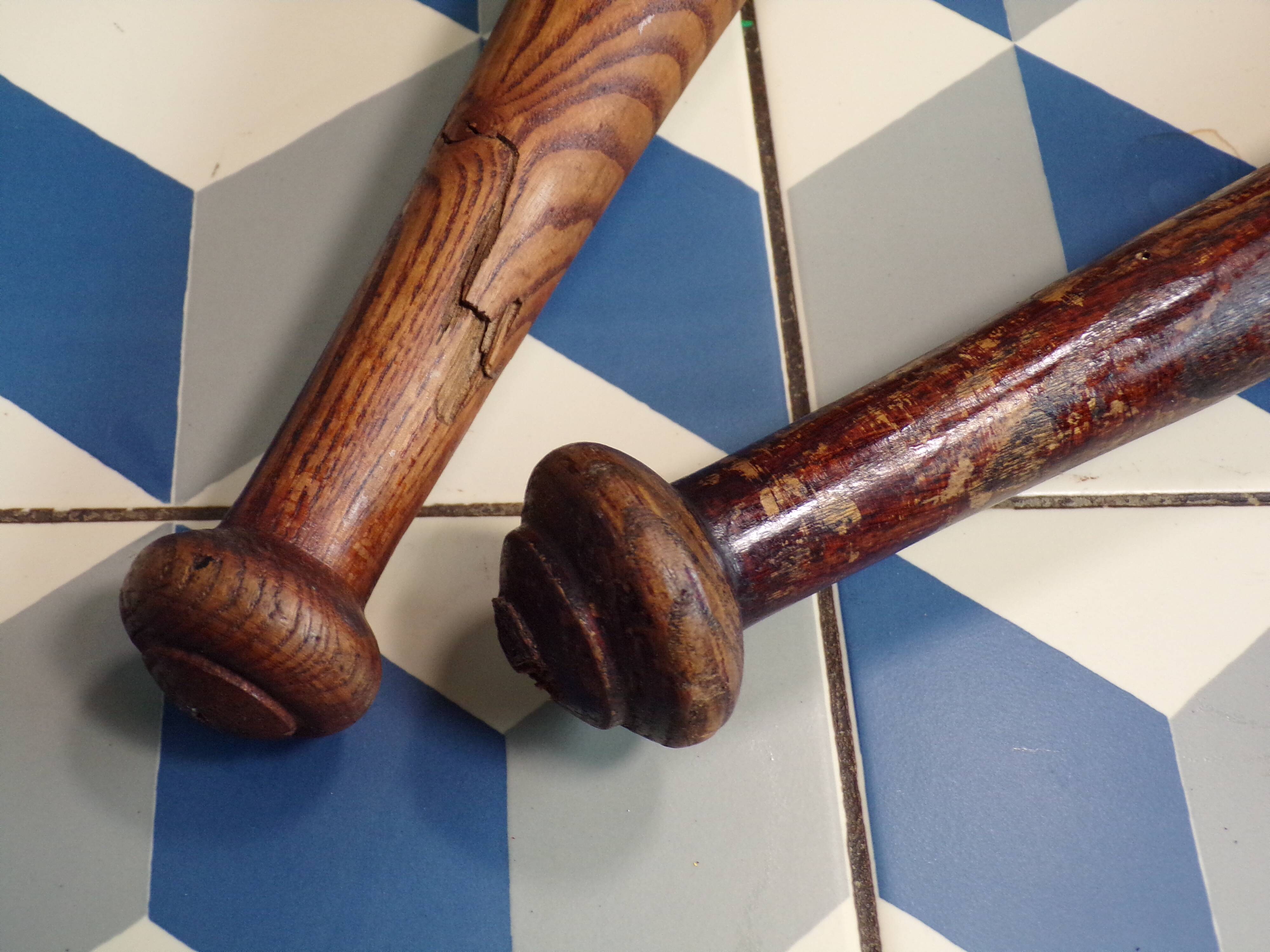2 old wooden juggling clubs