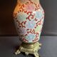 Old Asian vase mounted as a lamp with pagoda lampshade
