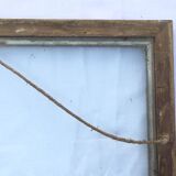 Gilded wooden frame and its glass