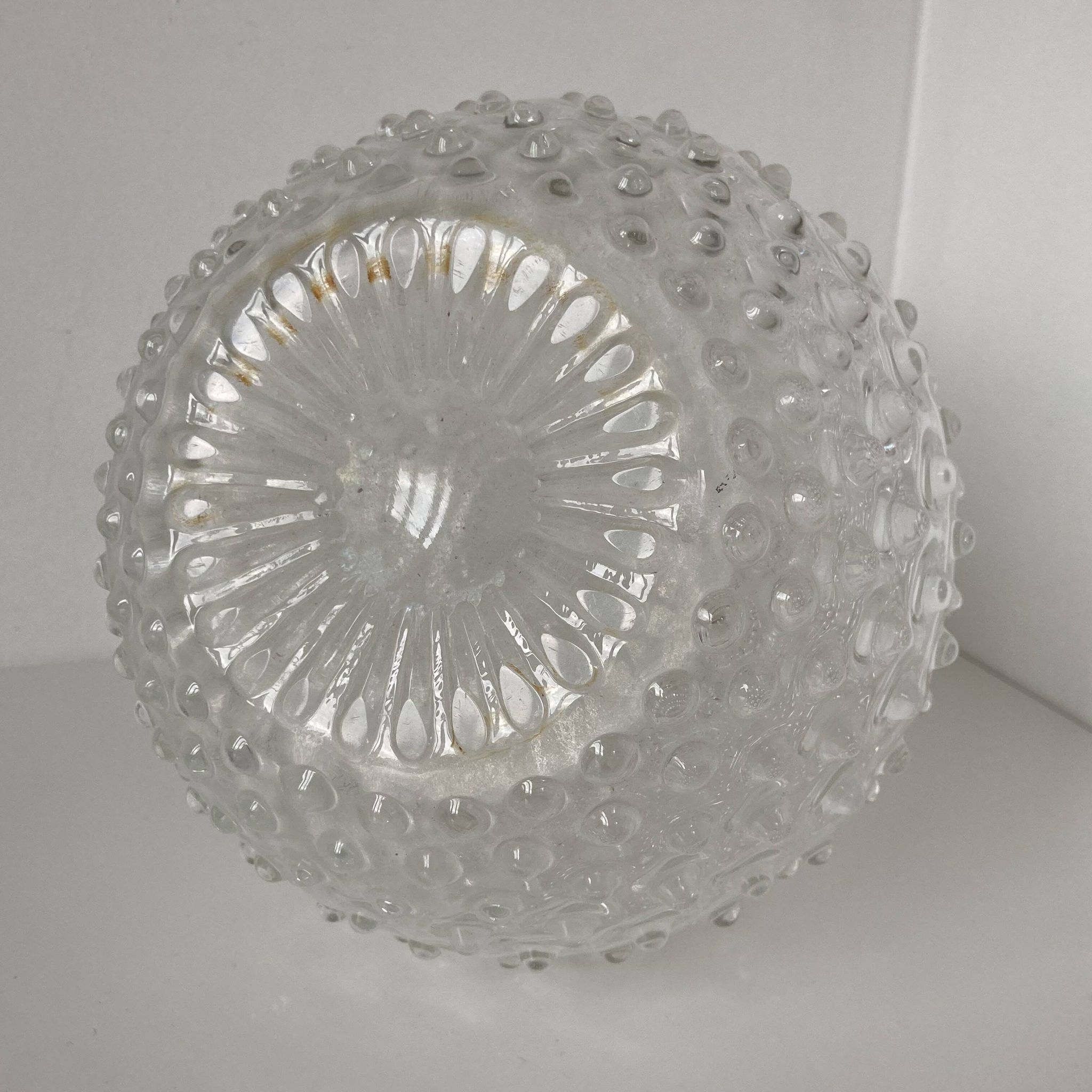Beautiful and large vintage glass jug with a handle, made of clear hot-worked glass.