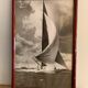 Three black and white-themed photographs sailboat boat with mahogany frame