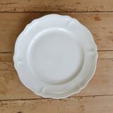 Round vintage ivory earthenware serving dish with scalloped rim.