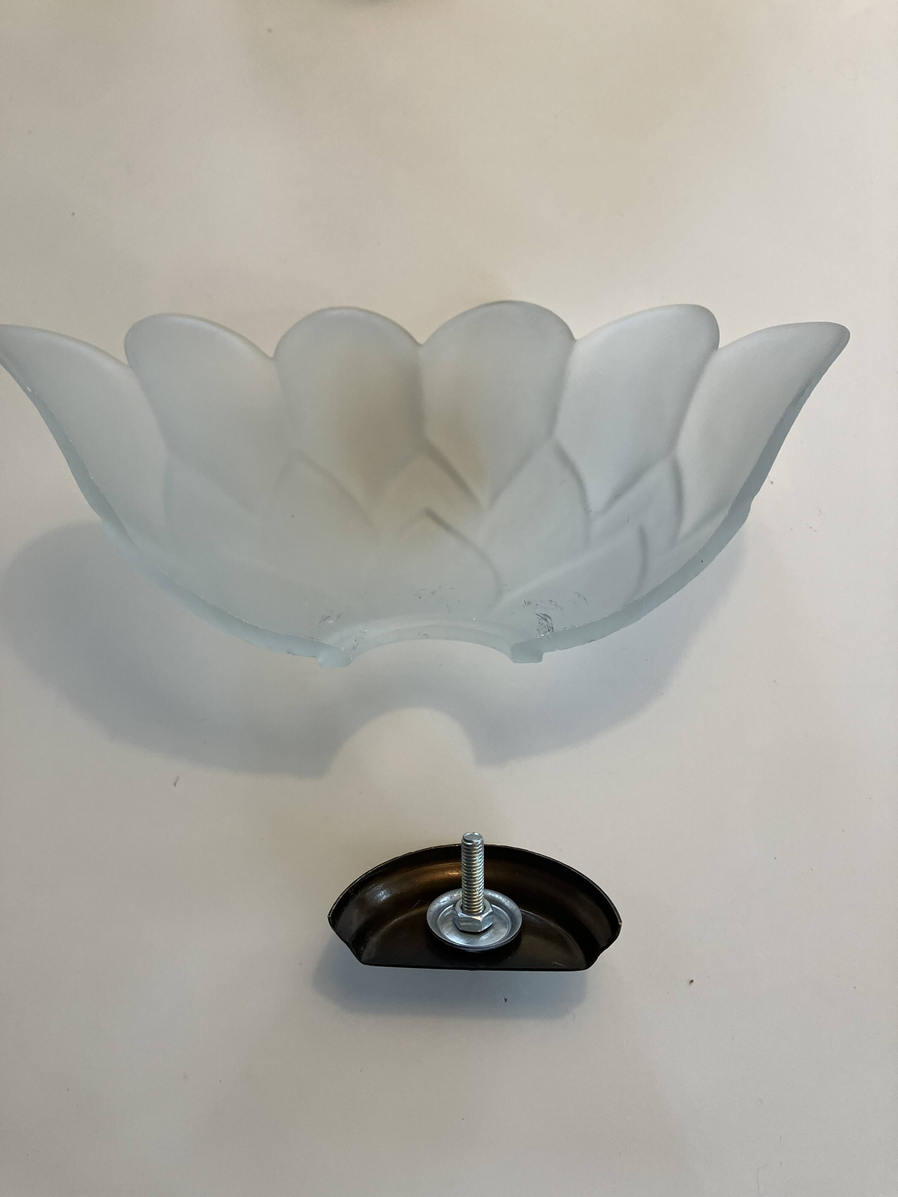 Pair of glass shell wall sconces with brass frames