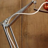 Orange articulated vintage desk lamp