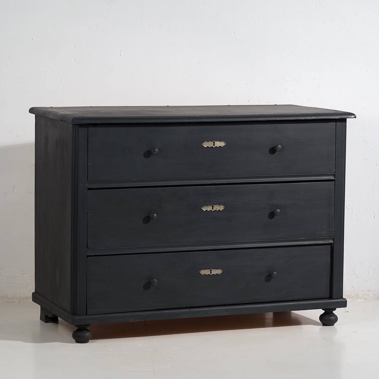 Antique chest of drawers in dark tones (c.1920)