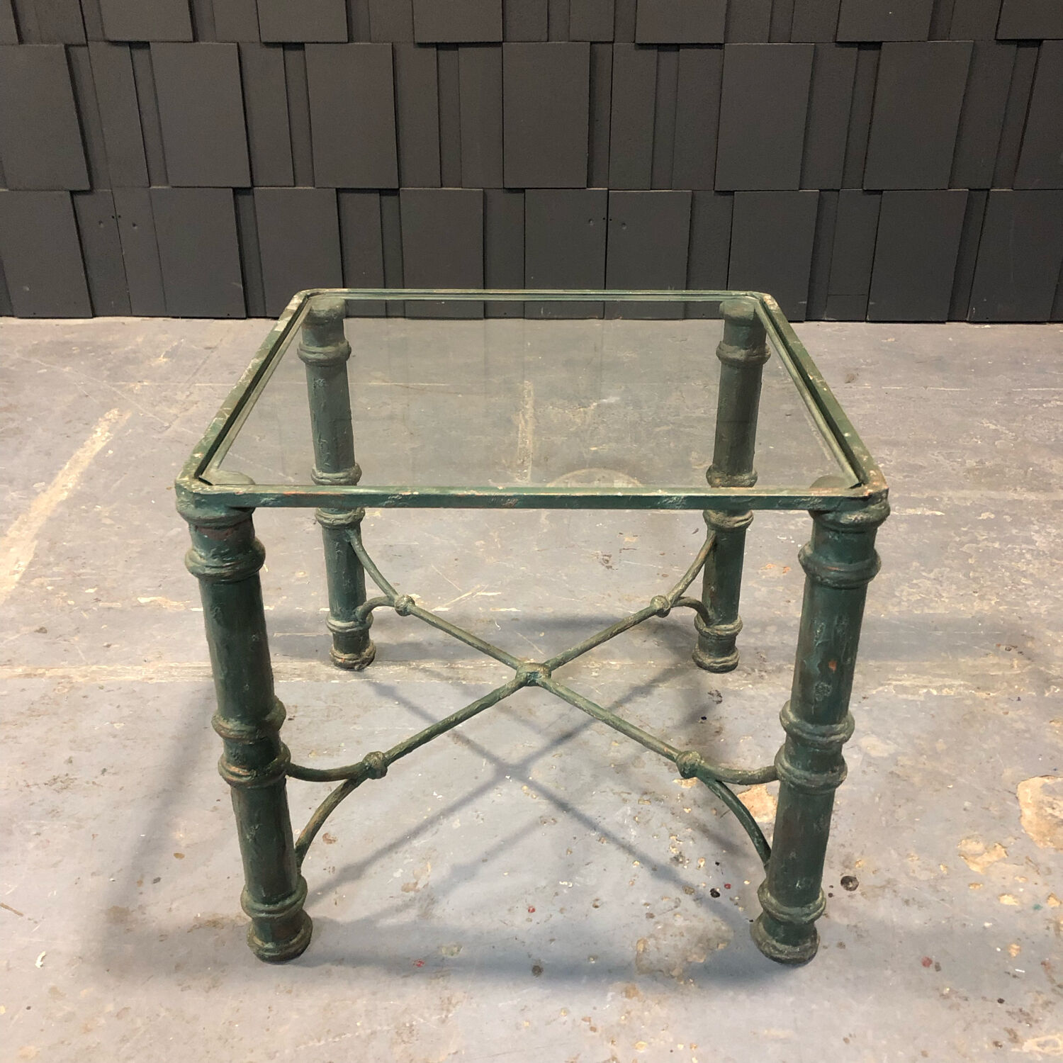 Iron and glass side table with antique patina