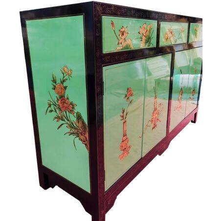 Lacquered buffet in soft green with floral patterns.