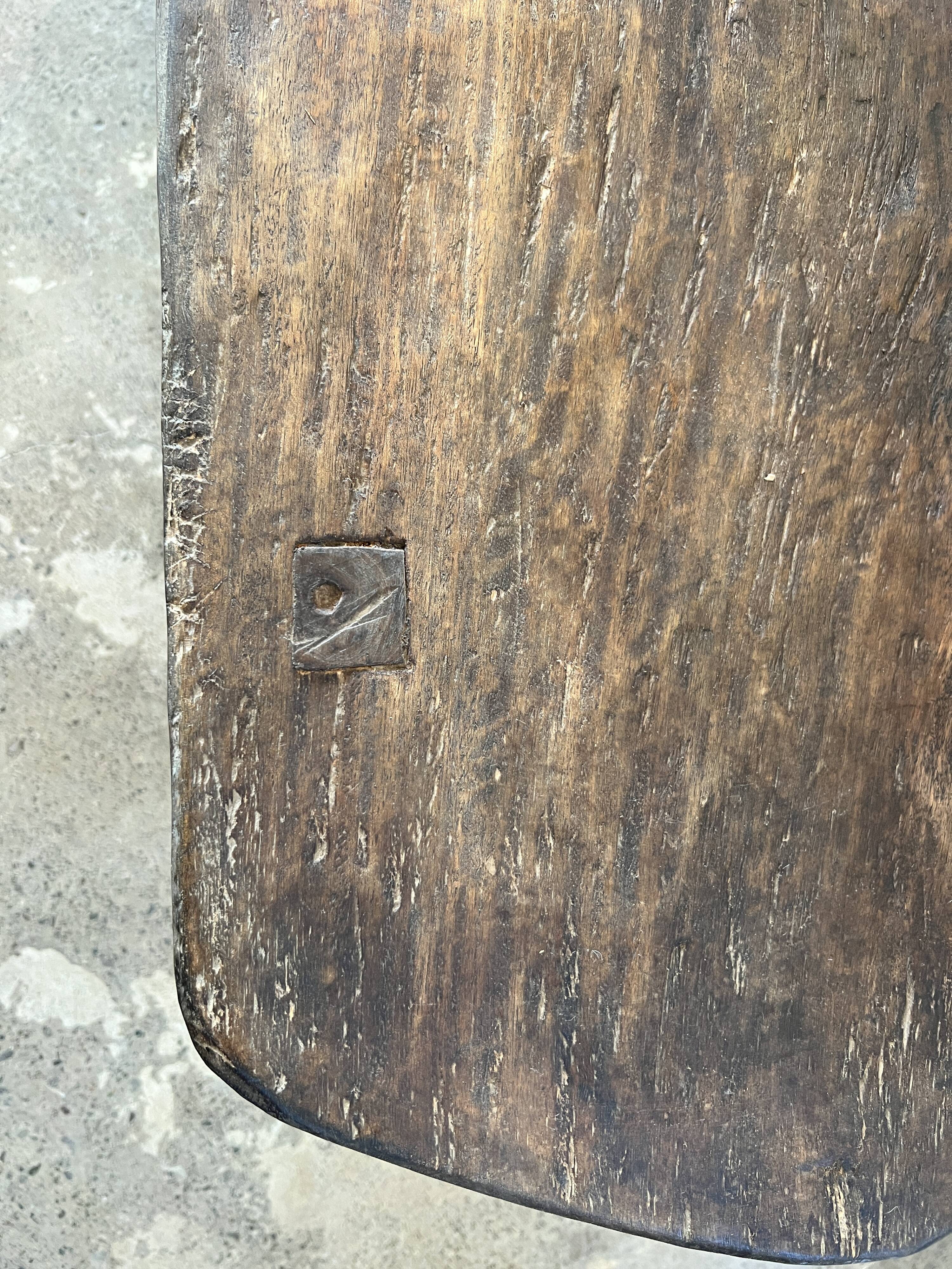 Large rounded coffee table in old Asian teak