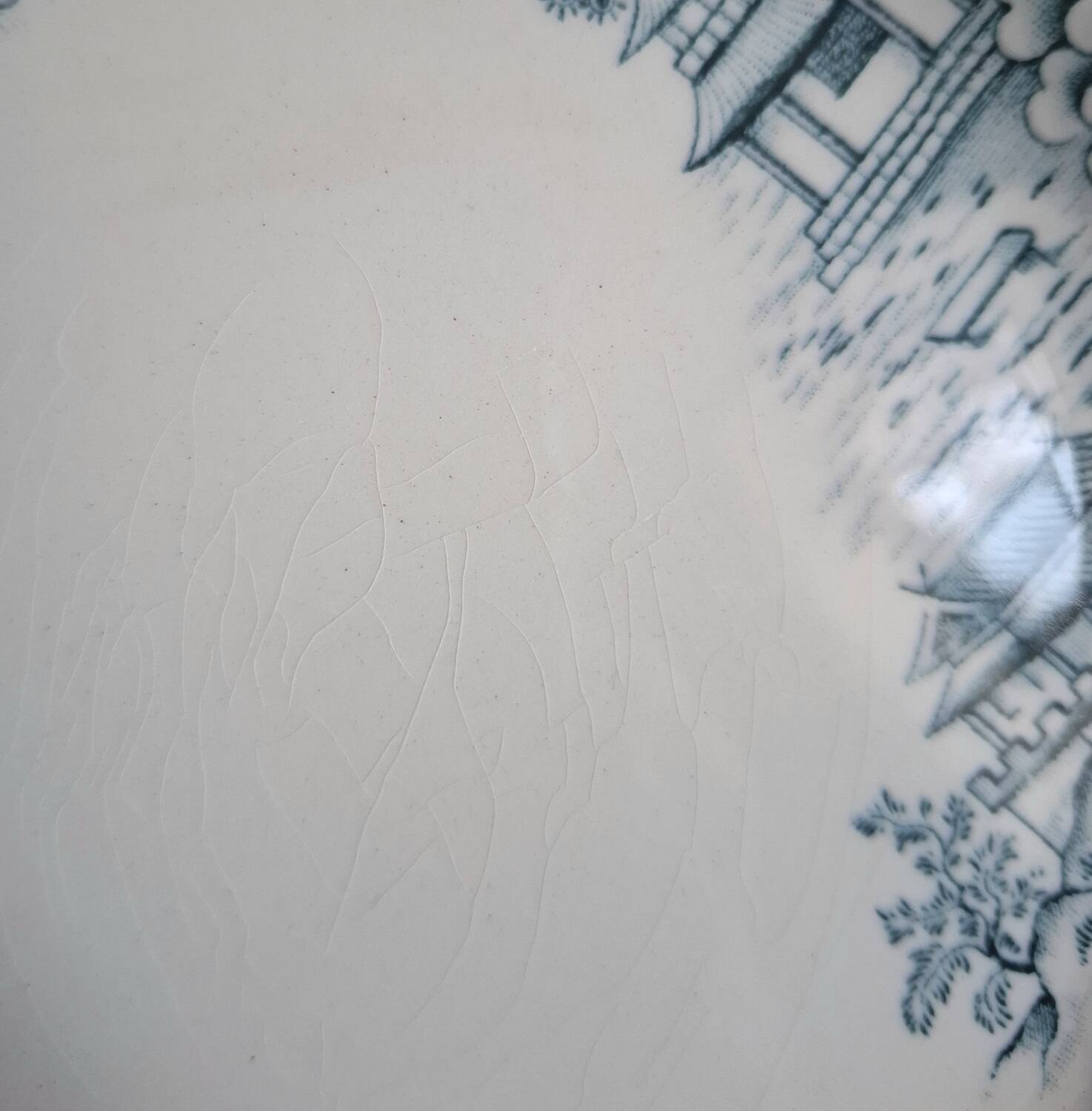 Mismatched antique flat plates made of ironstone accompanied by