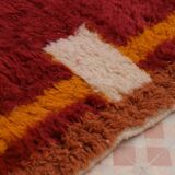 Minimalist burgundy cherry red shaggy berber rug