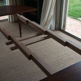 Round pine table with three extensions.
