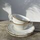 Pair of fine white and gold Limoges porcelain teacups