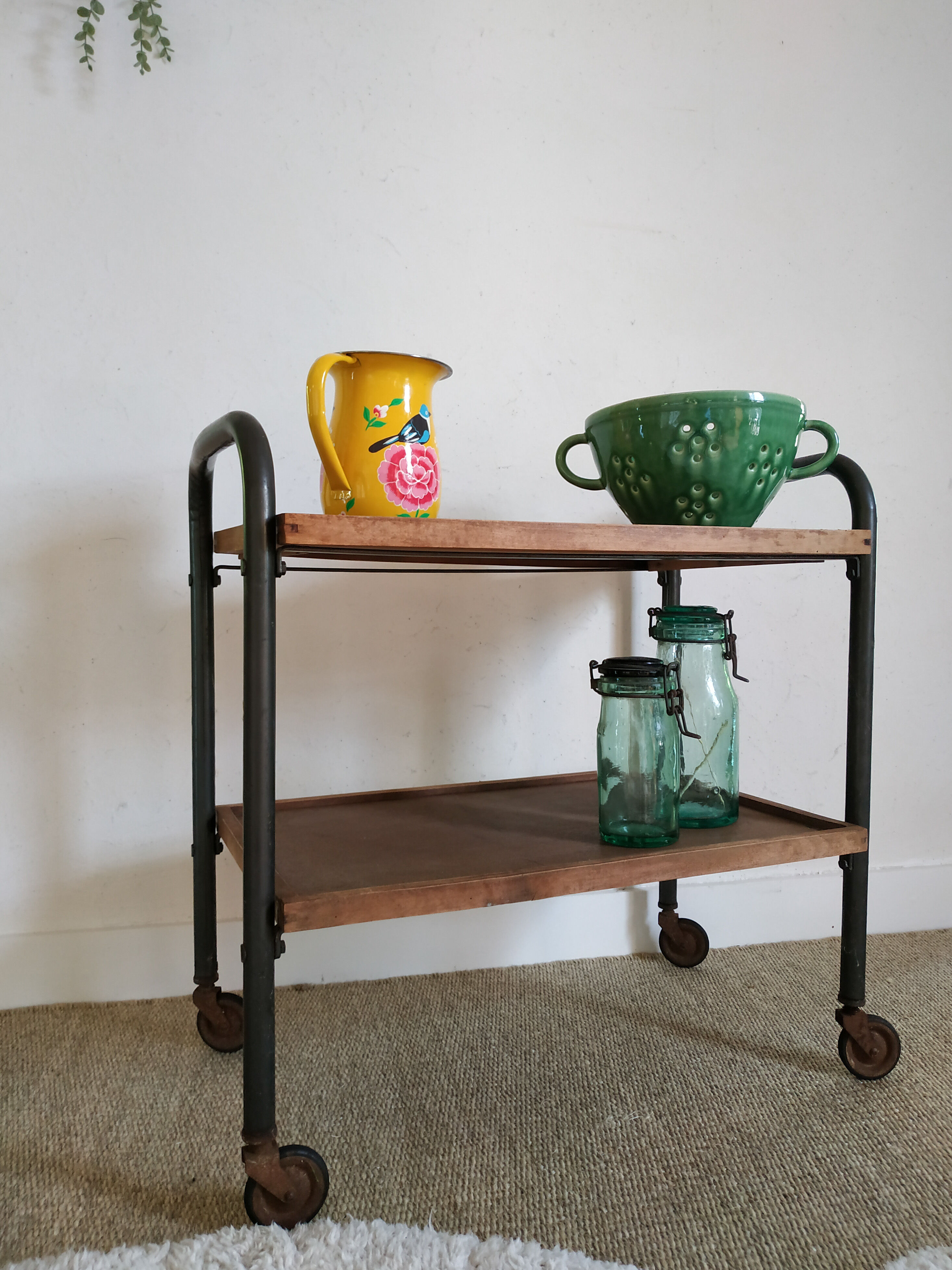 Serving table on metal wheels and antique wood