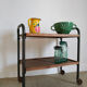 Serving table on metal wheels and antique wood