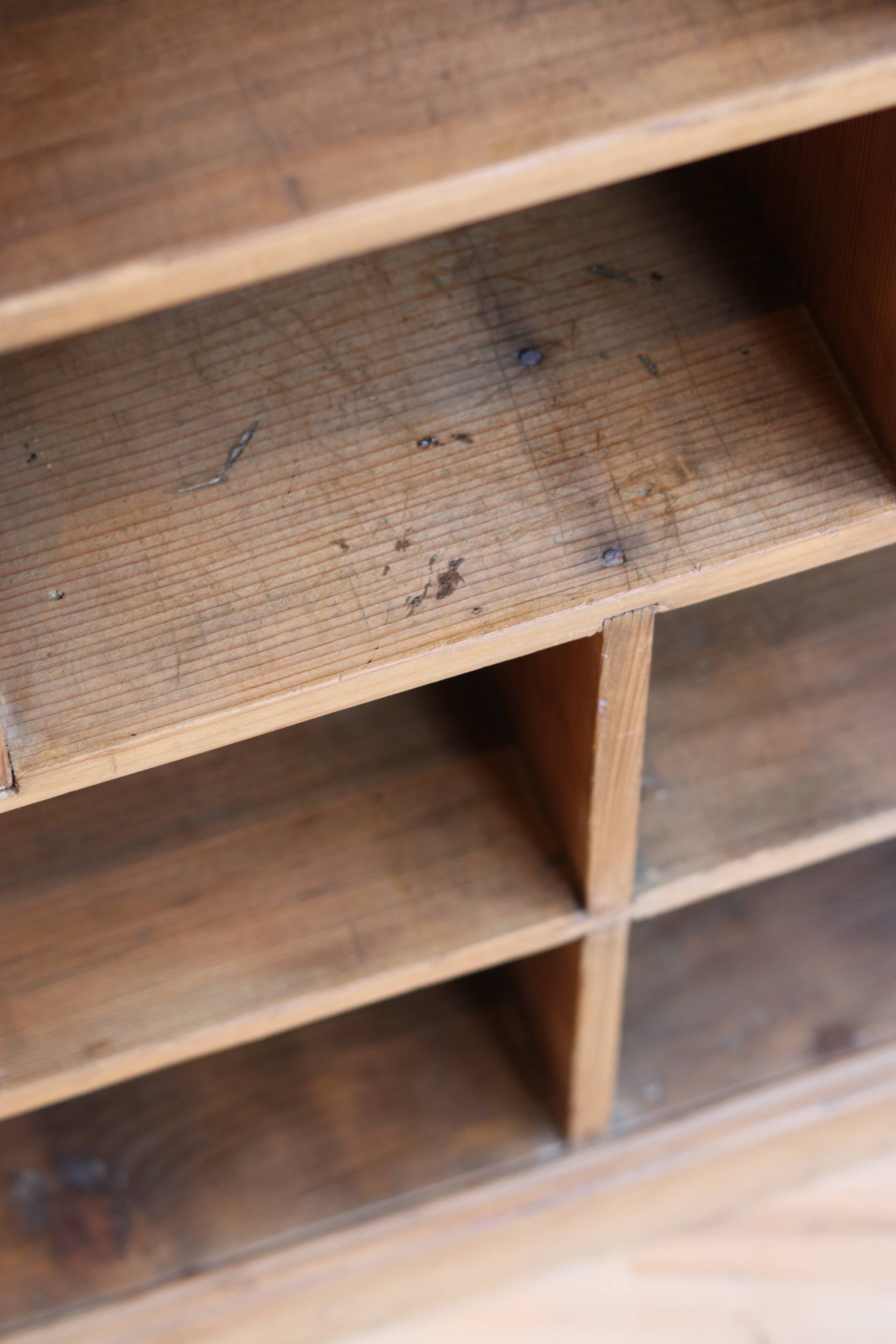 Large storage unit with compartments in waxed pine, early 20th century.