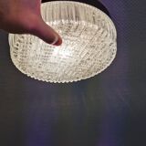 Ceiling light, in dark metallic paint with thick glass shade with beautiful details in the glass.