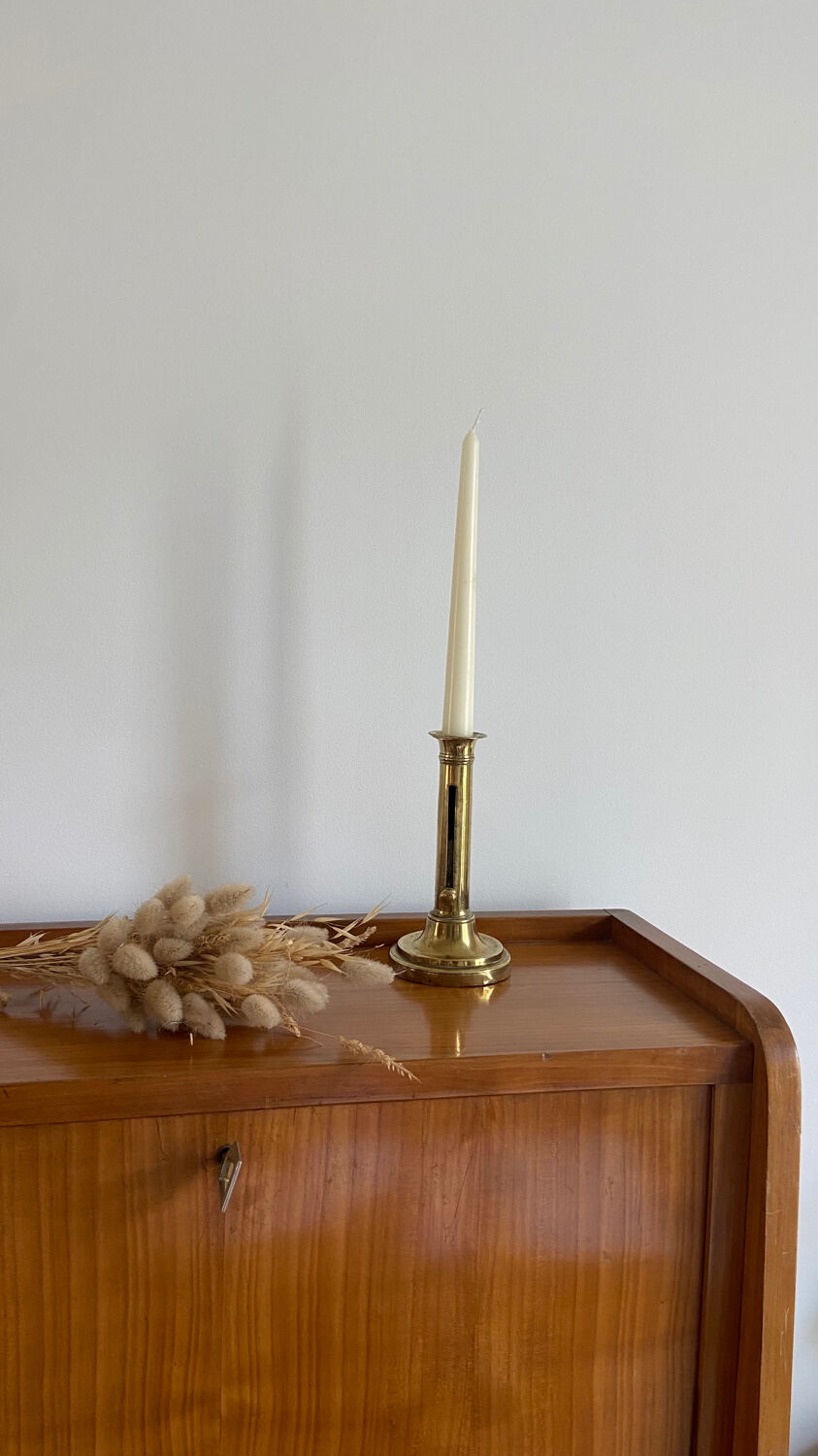 Old brass push candle holder