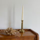 Old brass push candle holder