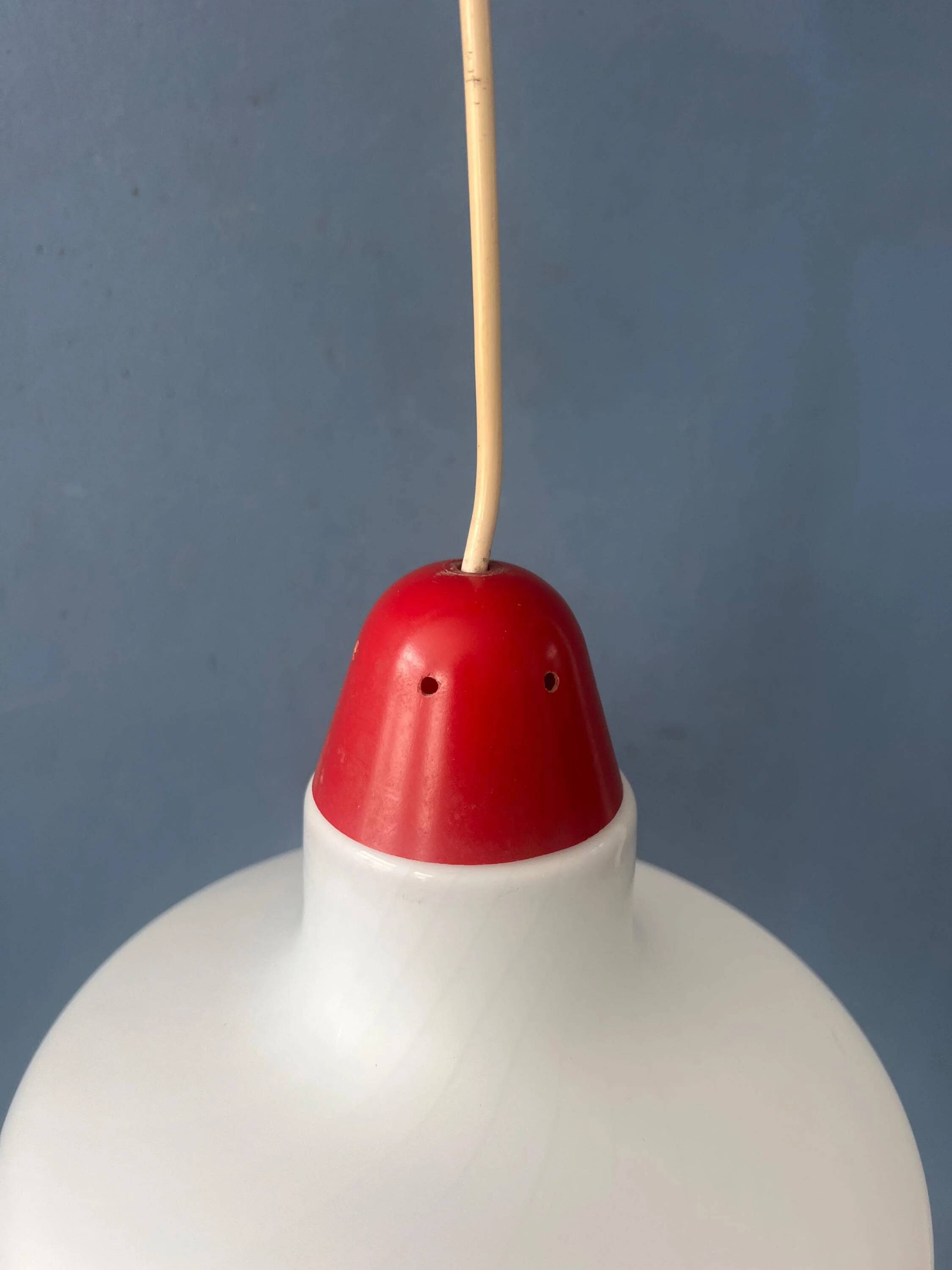 Mid-Century opaline glass suspension with a red upper part and ceiling cover.
