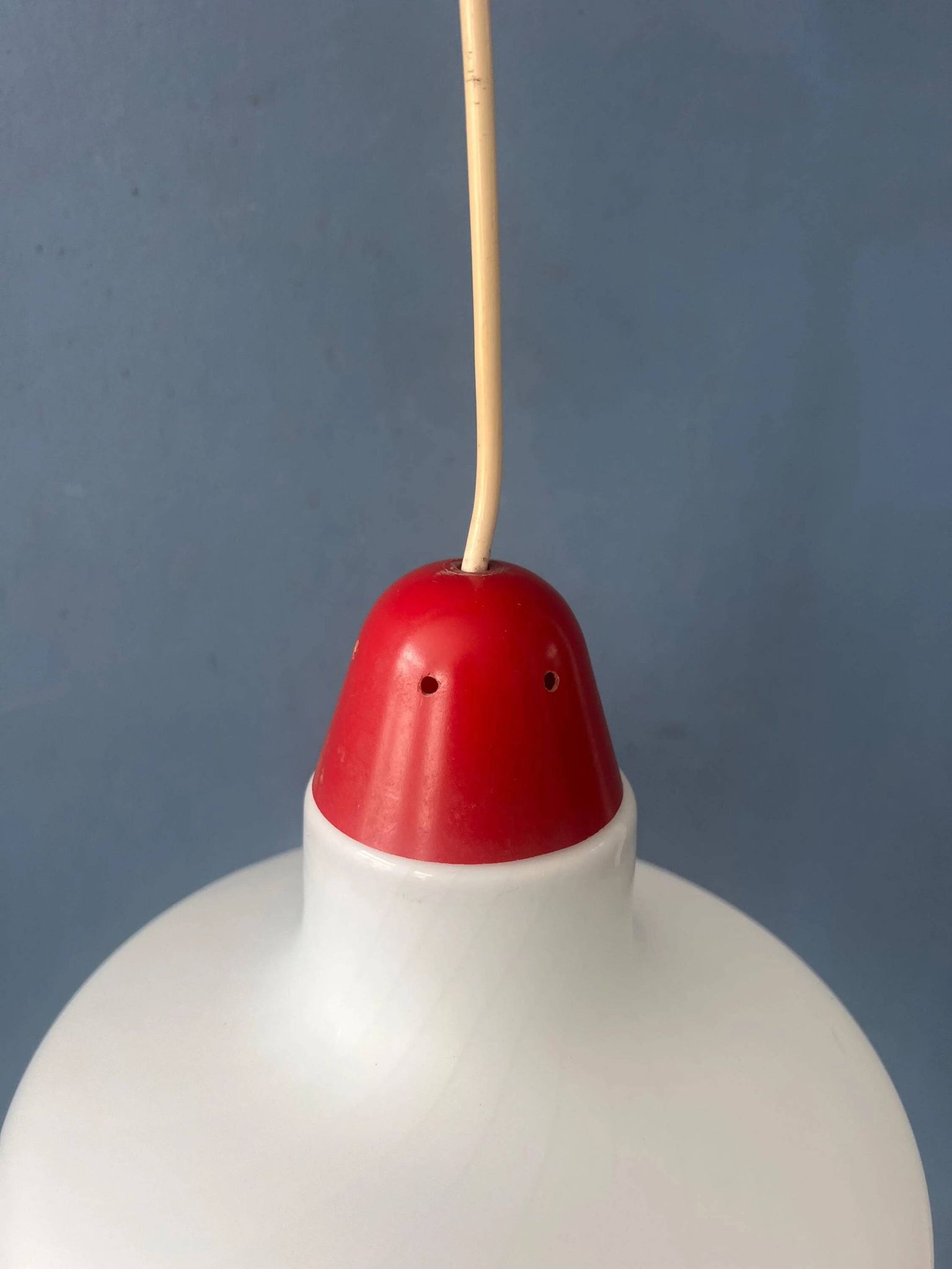 Mid-Century opaline glass suspension with a red upper part and ceiling cover.