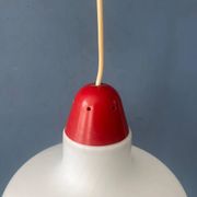 Mid-Century opaline glass suspension with a red upper part and ceiling cover.