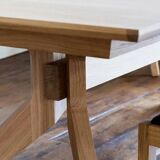 Wooden dining table with a cross extension.