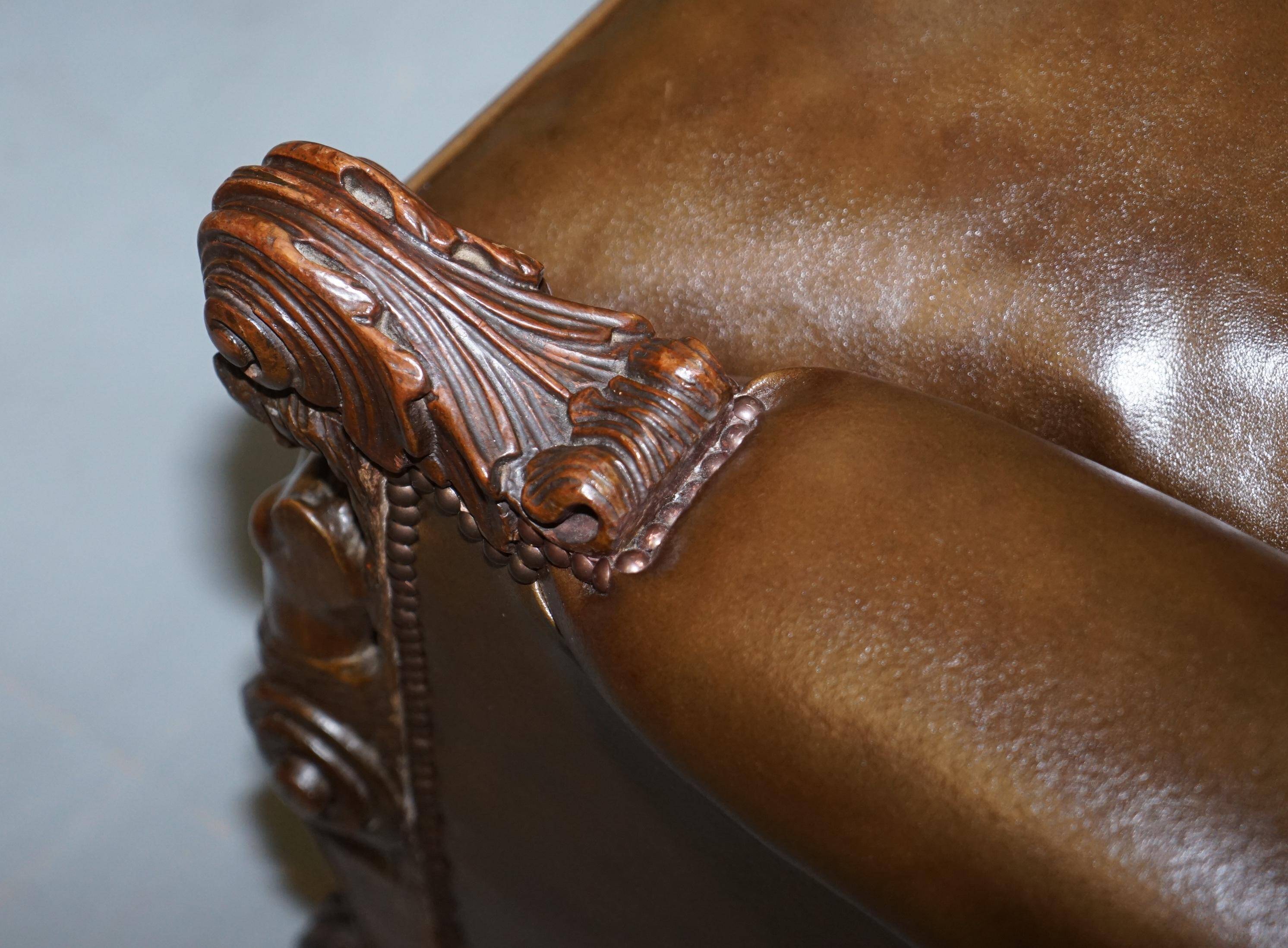 Restored Regency canapé in leather with sculpted Hermès frame.