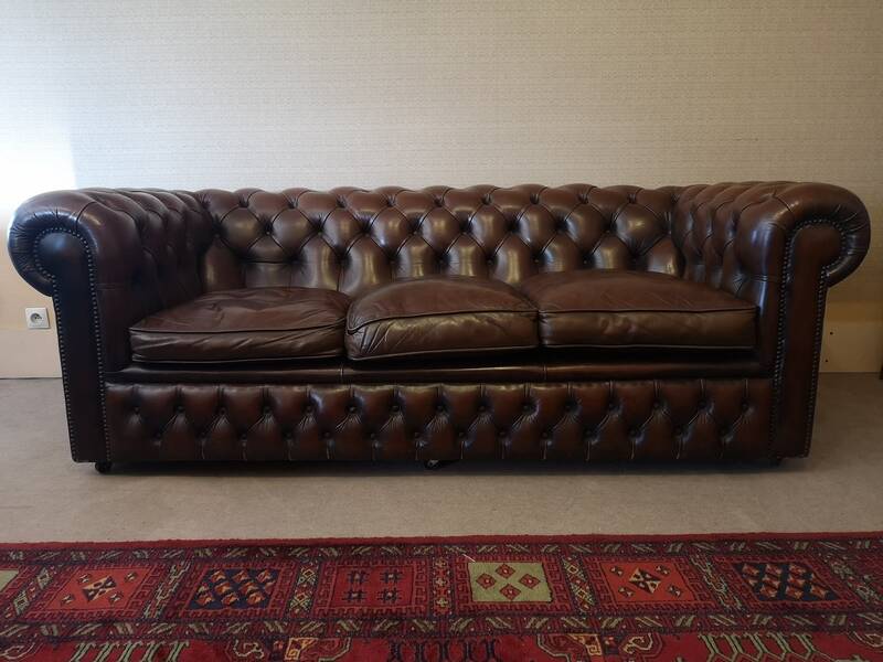 Vintage three-seater brown leather Chesterfield sofa