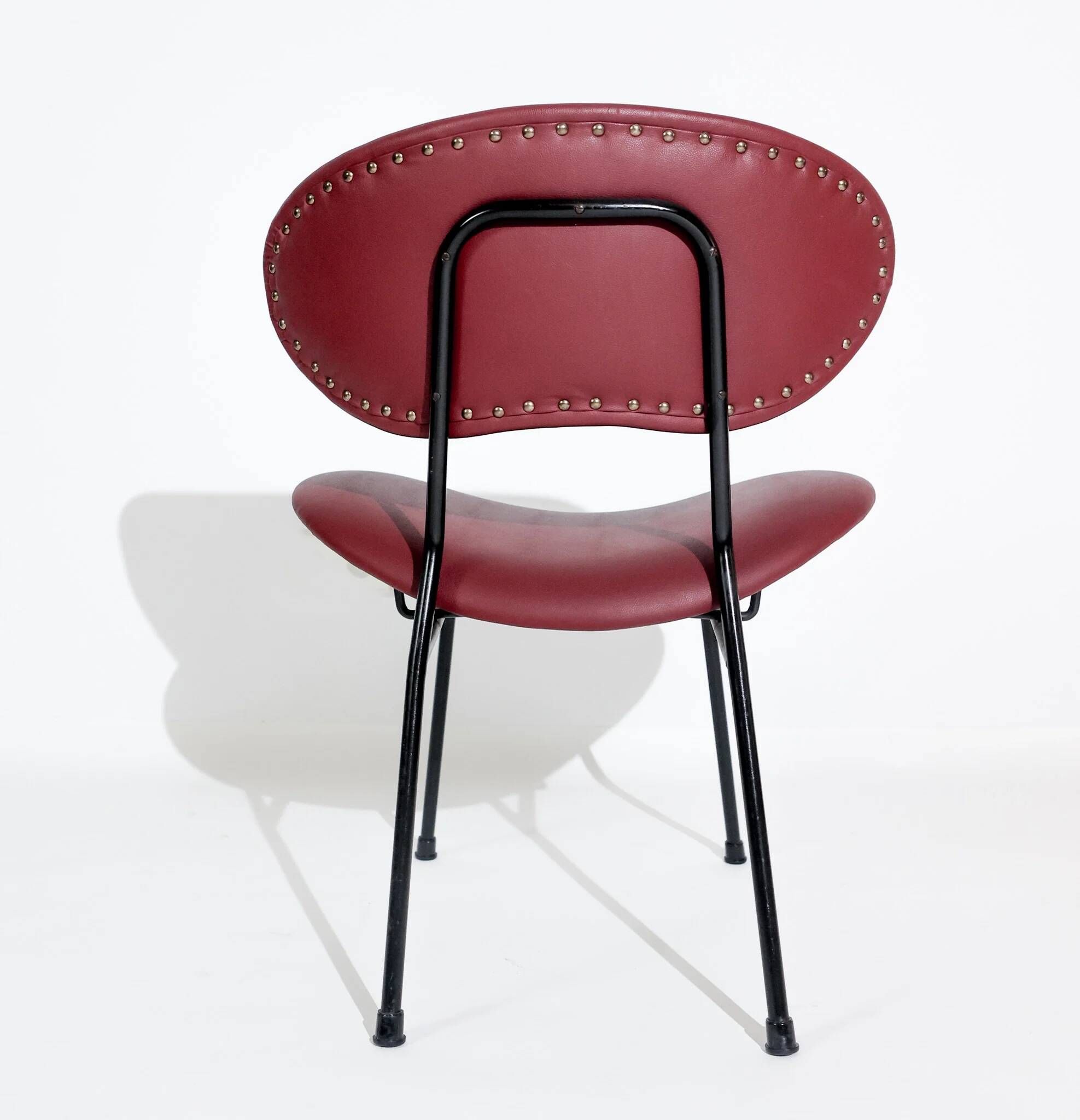 Vintage low chair by Gastone Rinaldi for Rima, black lacquered frame and burgundy upholstery, Italy, 1950s.