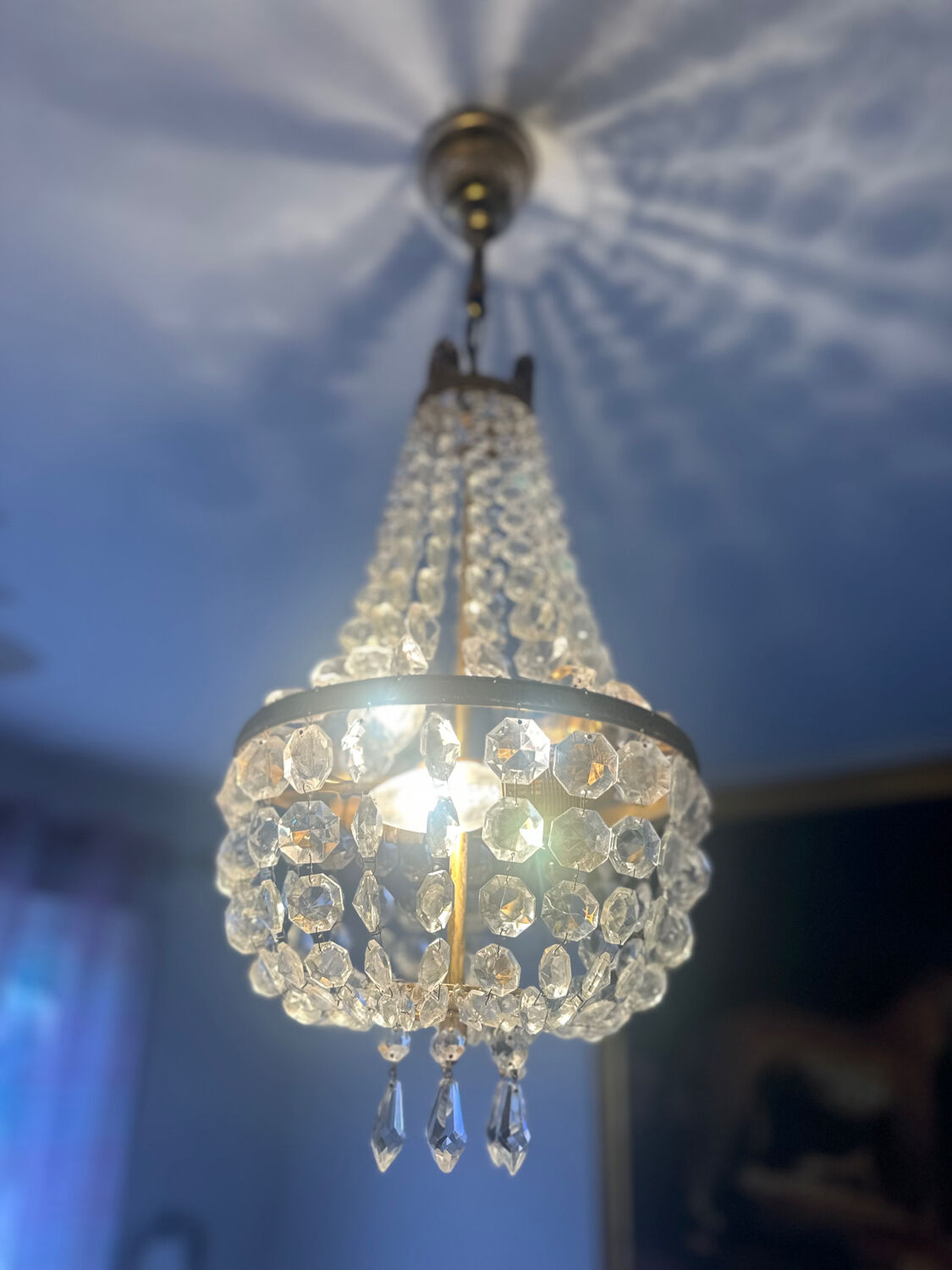 Basket chandelier with crystal and gilded brass pendants, circa 1930.
