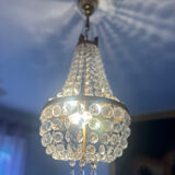 Basket chandelier with crystal and gilded brass pendants, circa 1930.