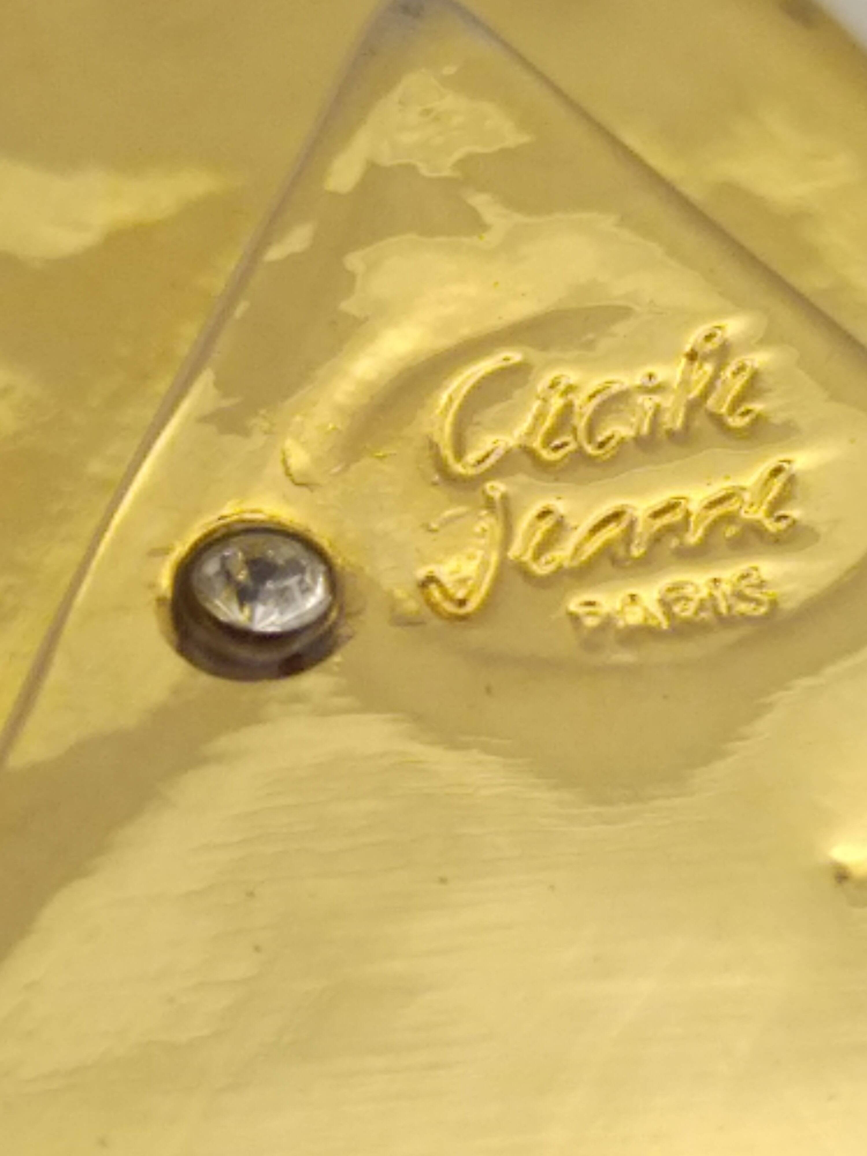 Cecile & jeanne: triangular gold-plated metal pocket tray with hieroglyph decoration.