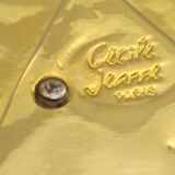 Cecile & jeanne: triangular gold-plated metal pocket tray with hieroglyph decoration.