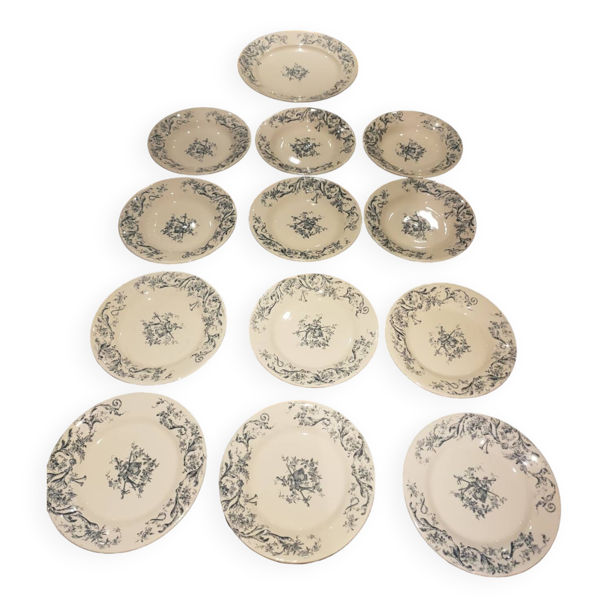 Service of old Gien earthenware plates and dishes