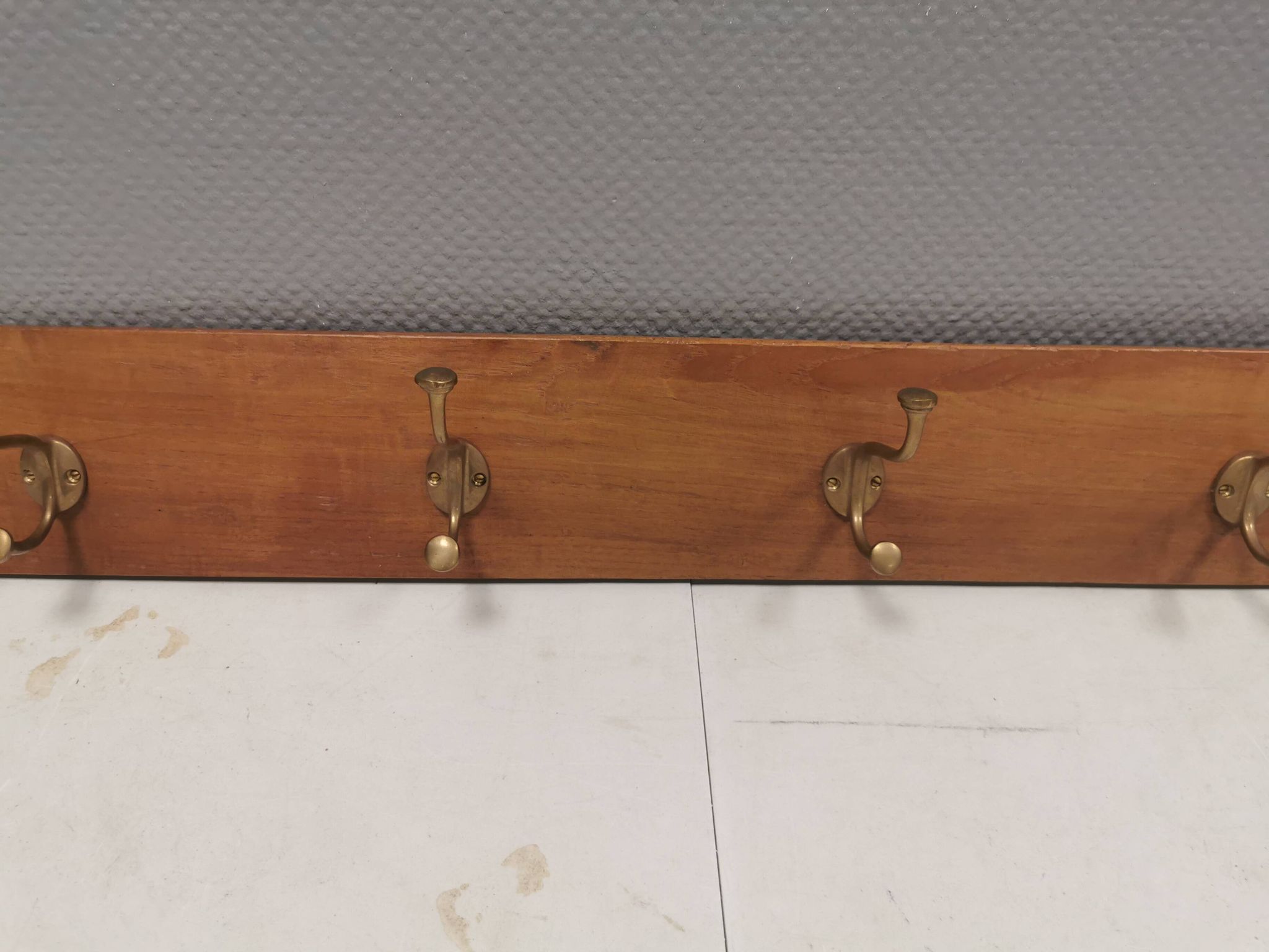 Coat rack in teak and brass. Denmark 1970-80s