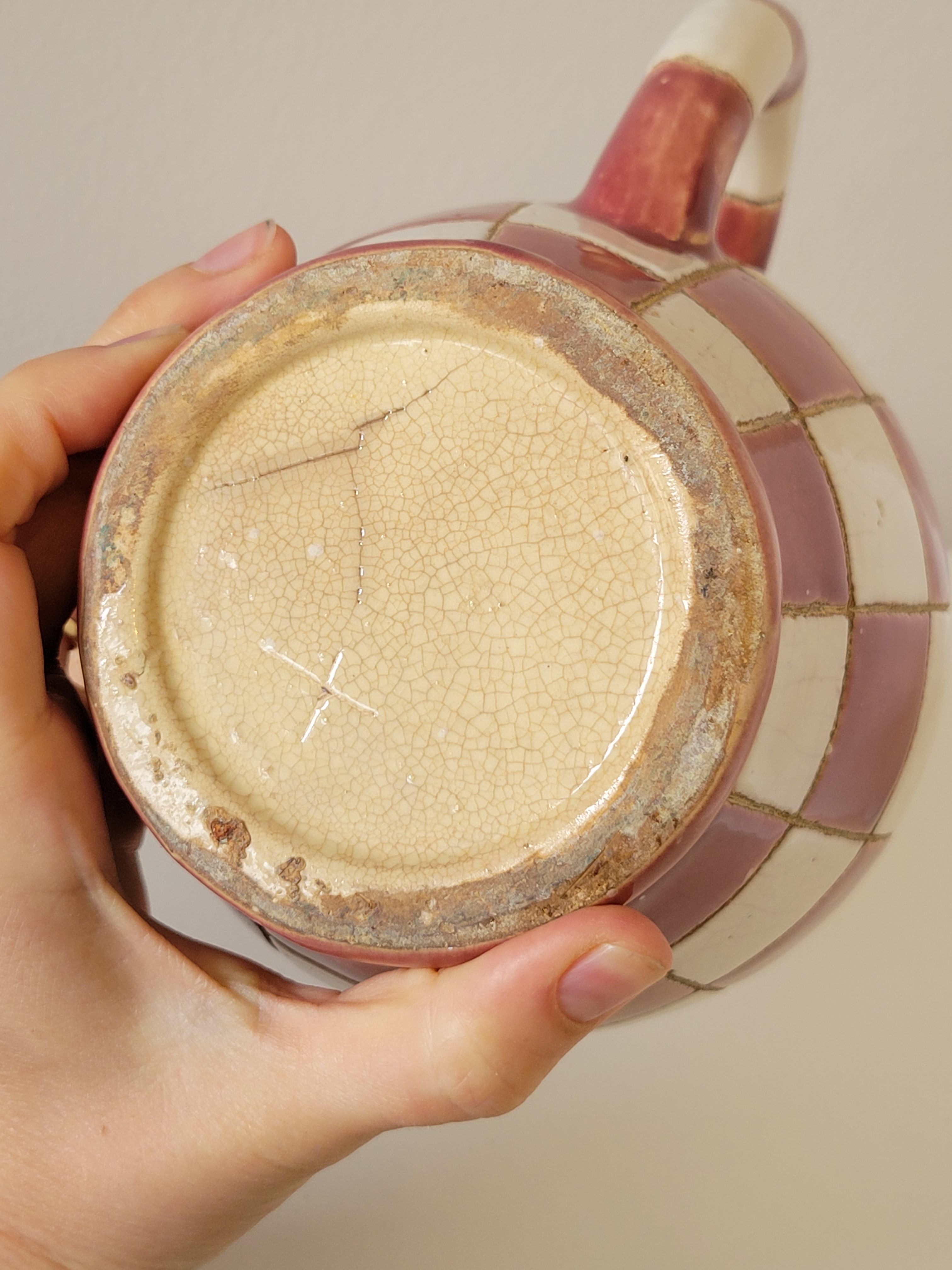 Old ceramic pitcher pattern checkerboard tiles