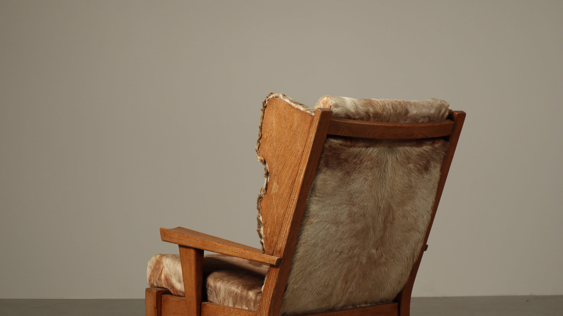 Brutalist oak lounge chair and ottoman in original goat hide, 1960s